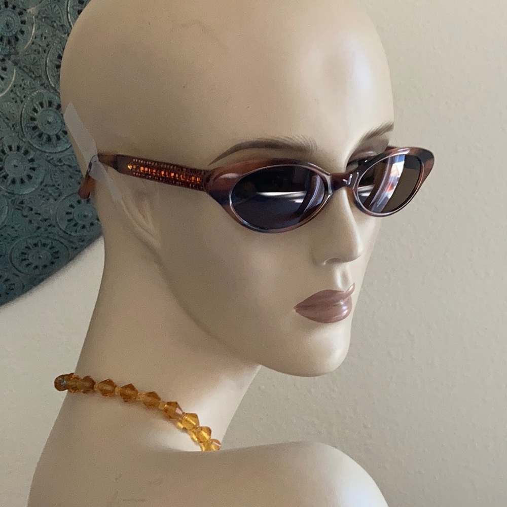 Judith Leiber cat eye sunglasses with crystal temples.